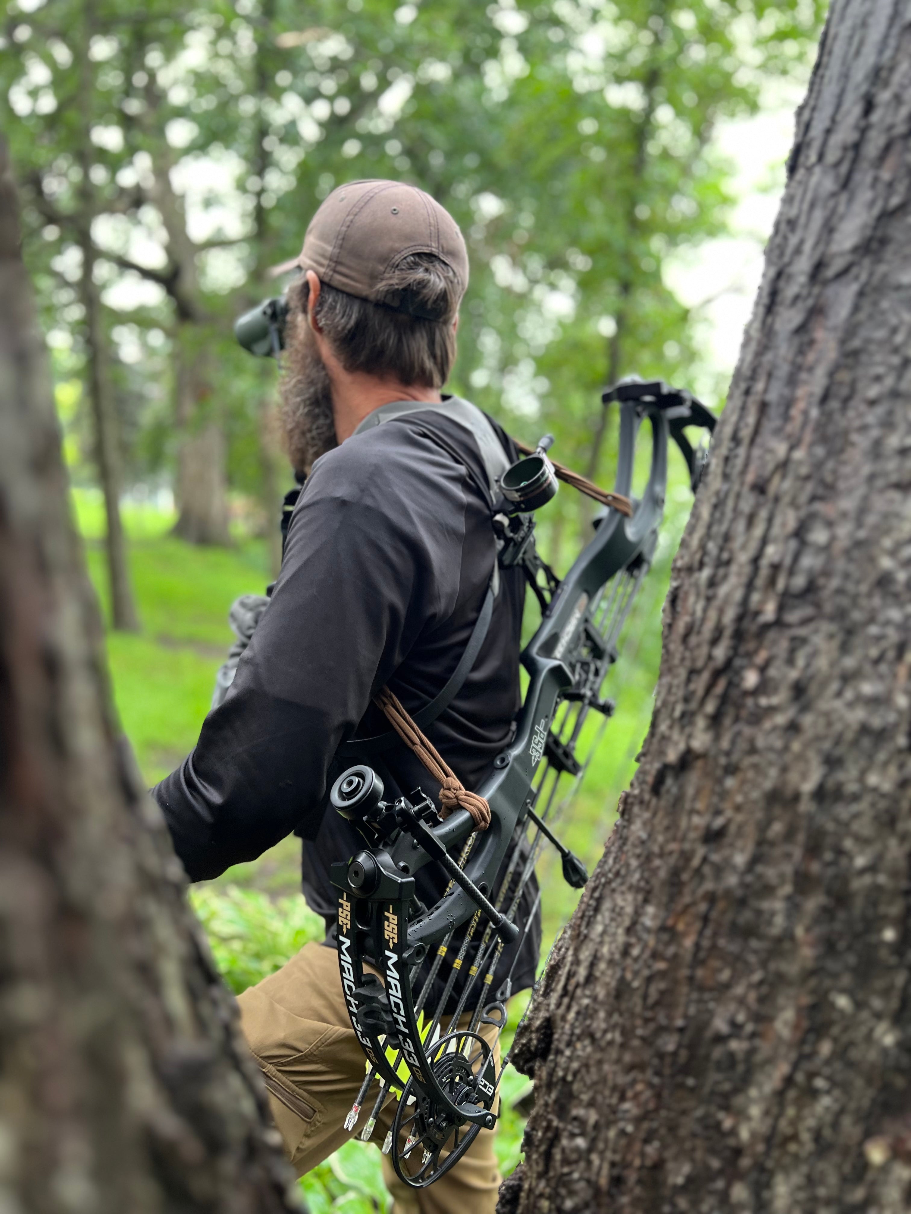 man with elastic bow sling on bow
