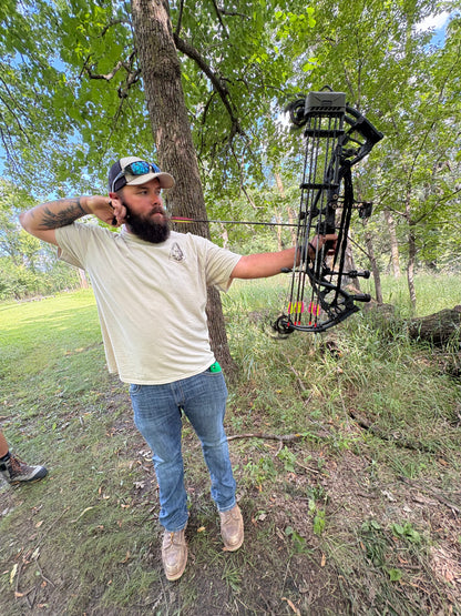 Young hunter carrying compound bow hands-free with Vsling® bow sling