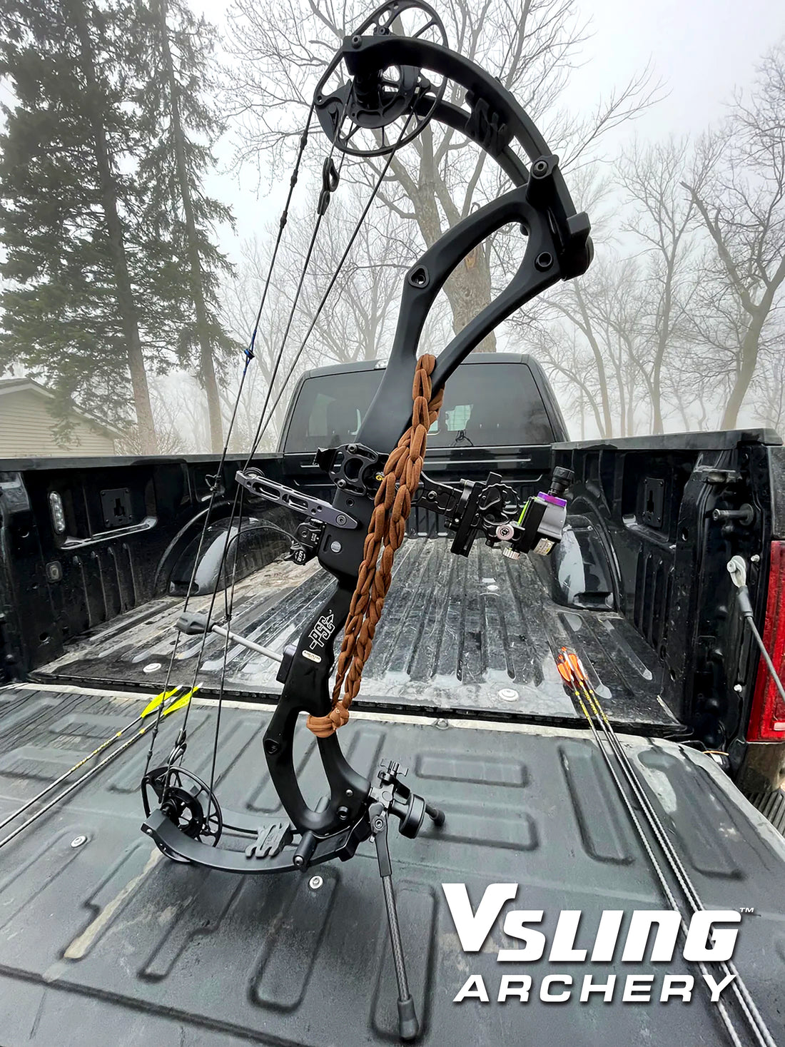 Hunter crossing a fence with Vsling bow sling on a Mathews compound bow in timber.