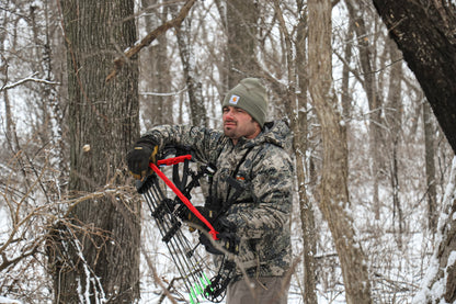 Close-up of Vsling bow sling elastic attachment secured to a Hoyt compound bow riser.