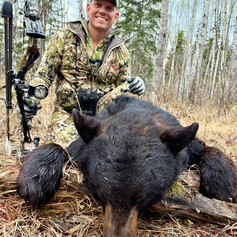 Josh with trophy black bear and Vsling bow sling on compound bow